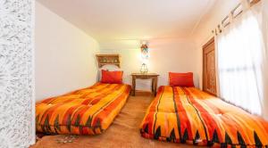 Postel nebo postele na pokoji v ubytování Riad 4 Jardins & Spa