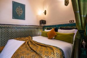 Postel nebo postele na pokoji v ubytování Riad 4 Jardins & Spa