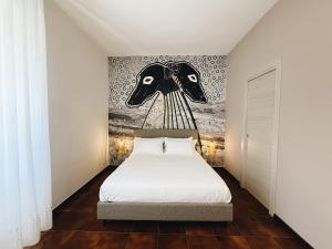 Ένα ή περισσότερα κρεβάτια σε δωμάτιο στο Numa Bed and Breakfast