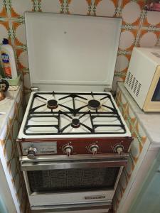 a stove sitting on top of a kitchen counter at Holiday home in Santa Cruz de Tenerife