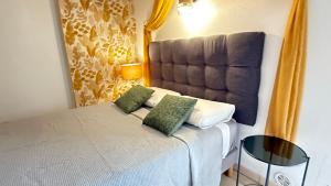 Ένα ή περισσότερα κρεβάτια σε δωμάτιο στο Cité Paoline Quiet Escape avec Terrasse Parking & Wi-Fi