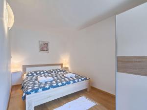 Postel nebo postele na pokoji v ubytování Holiday Home Mila by Interhome