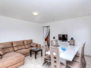 a living room with a couch and a table at Holiday Home Mercury by Interhome in Lloret de Mar
