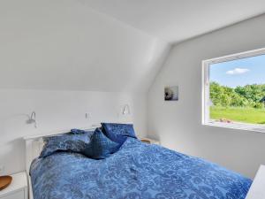 Postel nebo postele na pokoji v ubytování Holiday Home Ferienhaus Bude 92 by Interhome