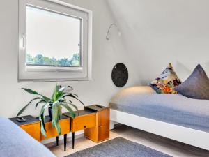 Postel nebo postele na pokoji v ubytování Holiday Home Ferienhaus Bude 92 by Interhome