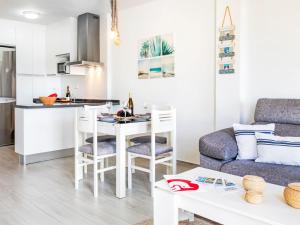 a kitchen and living room with a table and chairs at Apartment Marina by Interhome in Salobreña