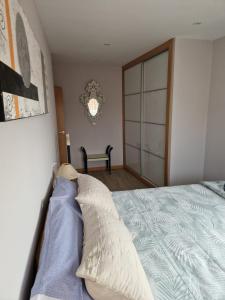 a bedroom with a bed with a pillow on it at Casa Rural Casa Leni in Hontoria de Valdearados +2 photos