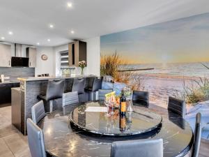 a dining room with a table and chairs at Holiday Home Landliebe by Interhome in Wingst +31 photos