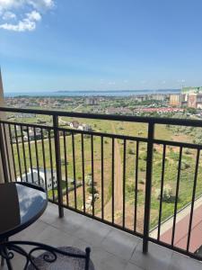 a balcony with a view of a city at Жемчужина 59 in Odesa