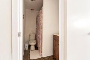 a bathroom with a toilet and a sink at Urban Casita in Los Angeles +13 photos