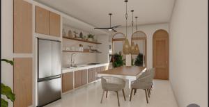 a kitchen with a table and chairs and a refrigerator at One room Villa - Le petit palace in Brisas de Zicatela
