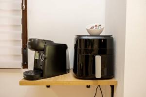 a coffee maker and a coffee pot on a shelf at El Silillo Burunchel in Cazorla