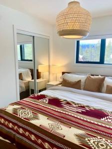 a bedroom with a large bed and a large mirror at The White House in Golden +24 photos