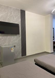 Postel nebo postele na pokoji v ubytování Eden Hotel