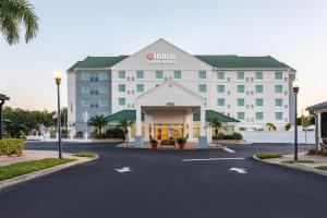 a hotel with a parking lot in front of it at Hilton Garden Inn Tampa Northwest/Oldsmar in Oldsmar