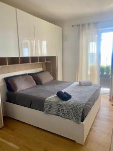 Ένα ή περισσότερα κρεβάτια σε δωμάτιο στο Trevignano Casa fronte lago