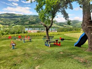 a park with a picnic table and a tree at Ferienhof Seeblick in Buchberg bei Herberstein