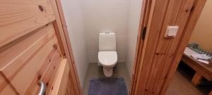 a bathroom with a toilet in a small room at Nurmenuku suvemaja in Tallinn +10 photos