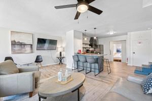 a living room with a couch and a table at Okc 6br Pet-friendly Near Penn Square #60 in Oklahoma City +22 photos