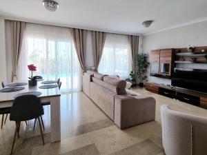 A television and/or entertainment centre at Charming Apartment with a Cozy Terrace