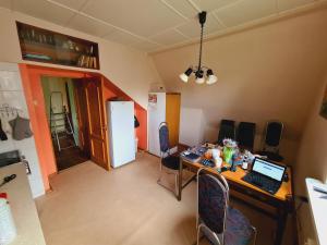 a kitchen with a desk with a computer on it at Haunted House Majori in Jūrmala