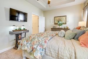 a bedroom with a bed and a flat screen tv at Private Patio Residential Condo in Cleveland! in Cleveland