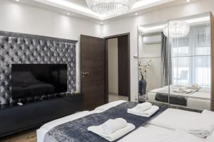 En eller flere senge i et værelse på Rebany Apartman 4 Central Location