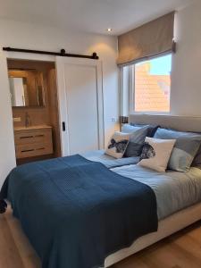 Postel nebo postele na pokoji v ubytování Appartement Havenzicht