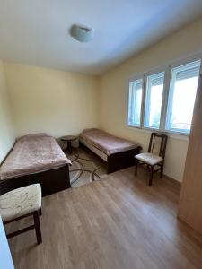 Postel nebo postele na pokoji v ubytování Apartmani Kostić