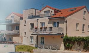 a large house with balconies on the side of it at le Gîte des 4 tours in Cattenom