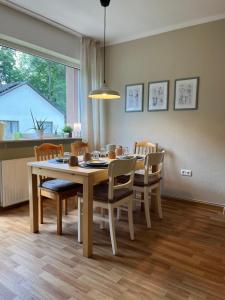 a dining room with a table and chairs at Liebignest in Michelstadt
