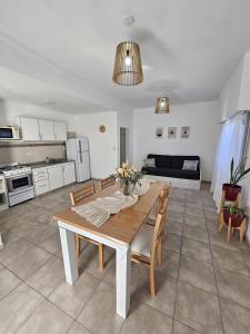a kitchen and living room with a table and chairs at La Pausa in Santa Rosa