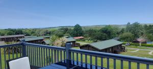 a balcony with a view of a group of houses at Lake view in Newquay