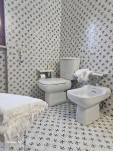 a bathroom with a toilet and a sink in it at A Casa da Maria in Melissano +40 photos