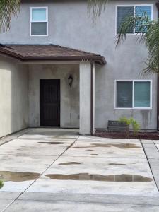 a house with a driveway in front of it at My amazing home in Azusa