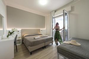 Postel nebo postele na pokoji v ubytování Hotel Royal