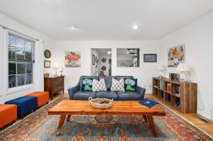 a living room with a couch and a coffee table at To The Lighthouse in Birch Town