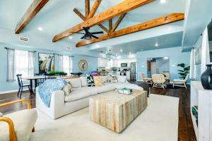 a living room with a couch and a table at Direct Beach Access Beachfront in Freeport