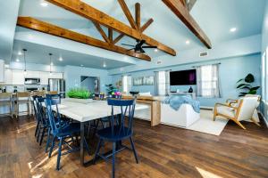 a kitchen and living room with a table and chairs at Direct Beach Access Beachfront in Freeport