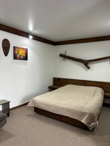 Postel nebo postele na pokoji v ubytování Гостьовий Дім Guest House