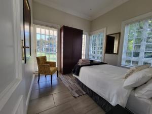 Katil atau katil-katil dalam bilik di Houghton Garden Manors +22 gambar