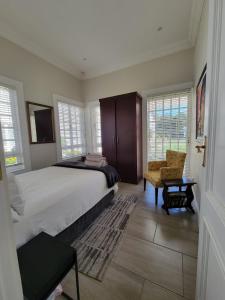 Katil atau katil-katil dalam bilik di Houghton Garden Manors