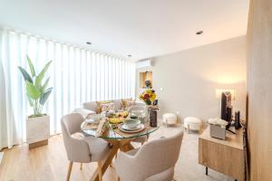 a living room with a table and a couch at Seventy Four House in Braga +12 photos