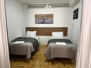 Un pat sau paturi într-o cameră la Sara City Center