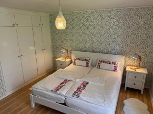 Postel nebo postele na pokoji v ubytování Hus Bellö + 27 fotografií