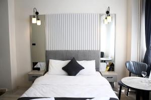 Ένα ή περισσότερα κρεβάτια σε δωμάτιο στο Blanco Boutique Hotel