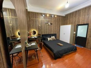 a bedroom with a bed and a desk in it at 17c dang van ngu 403 in Ho Chi Minh City
