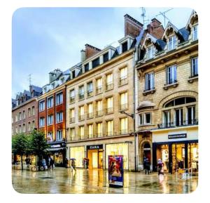 a group of buildings on a city street at Appart Duplex Proche Centre in Amiens