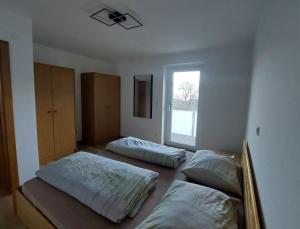 Postel nebo postele na pokoji v ubytování BergSeeZauber