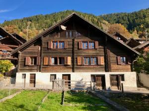 a large wooden house in the mountains at Ca da Viola in Cavagnago